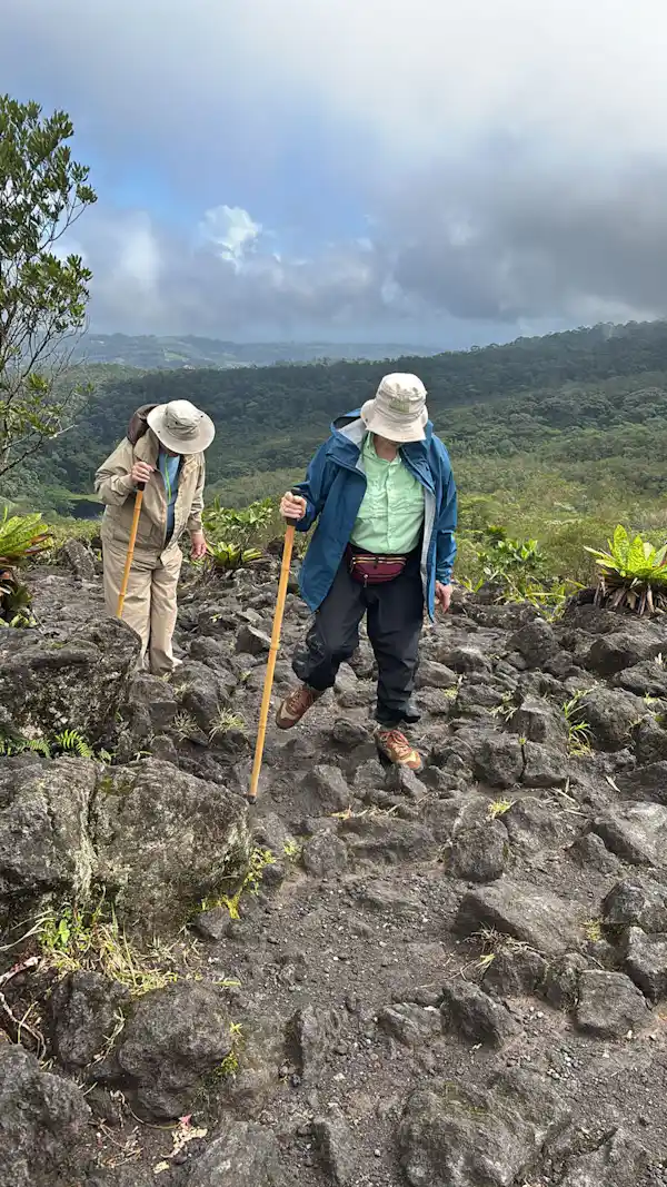 Rainforest Explorers guide pointing out hidden geological features on the Arenal slopes