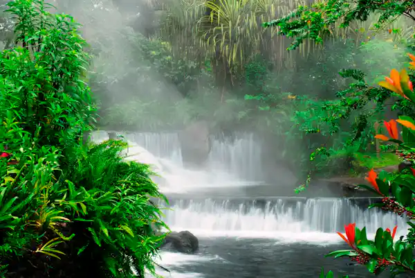 Iconic Tabacon natural thermal river and cascading waterfalls flowing through lush tropical gardens in Arenal